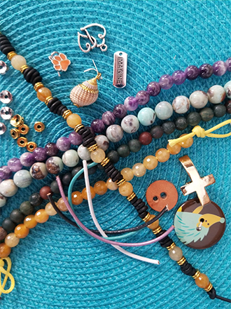 a collection of beaded bracelets and charms
