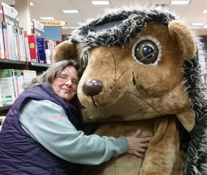 Conformation Judge Teresa Johnson and hedgehog in costume.